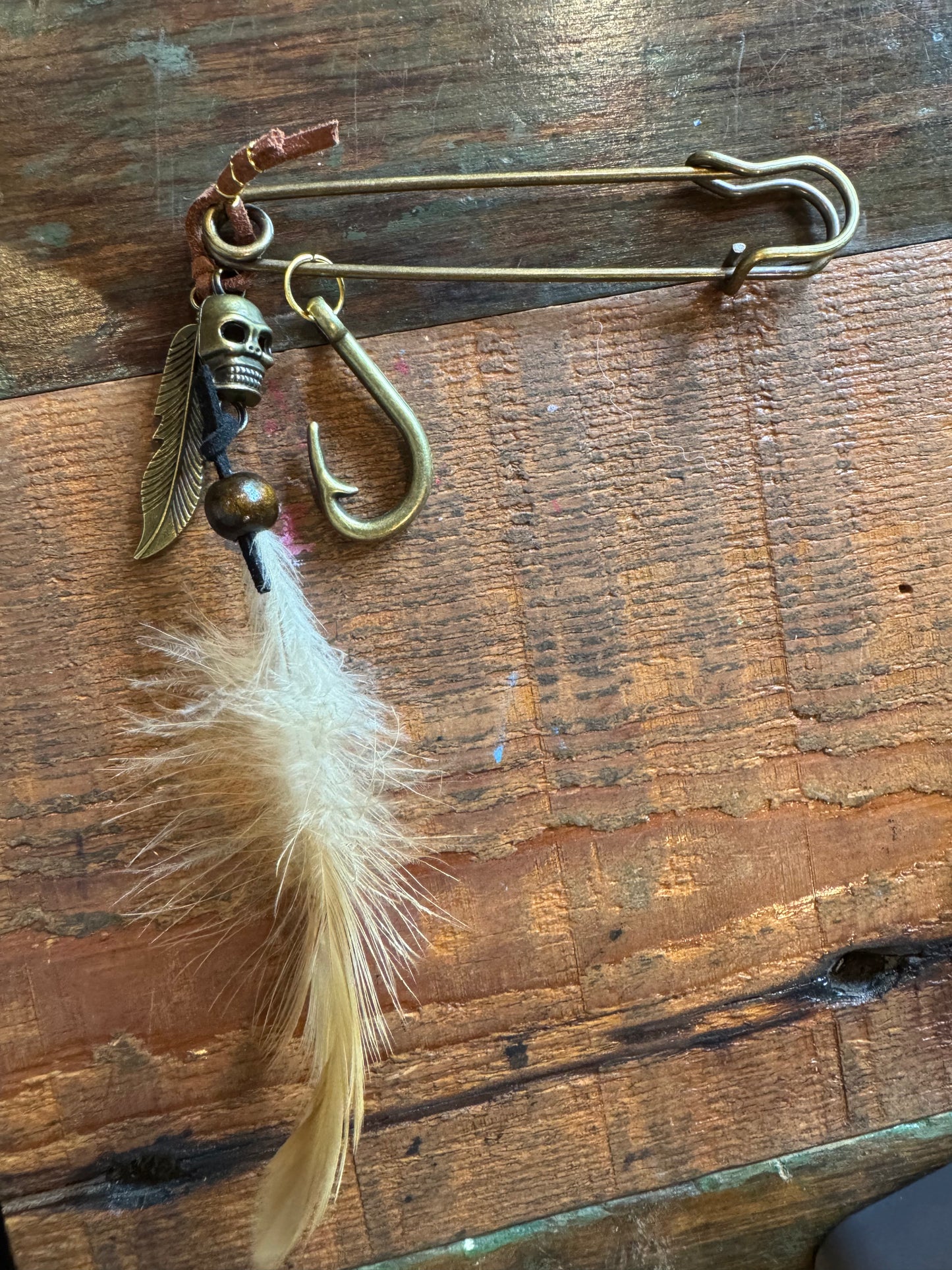 Large Hat Pin Featuring Various Colored Feathers and Various Pirate Charms $21.00