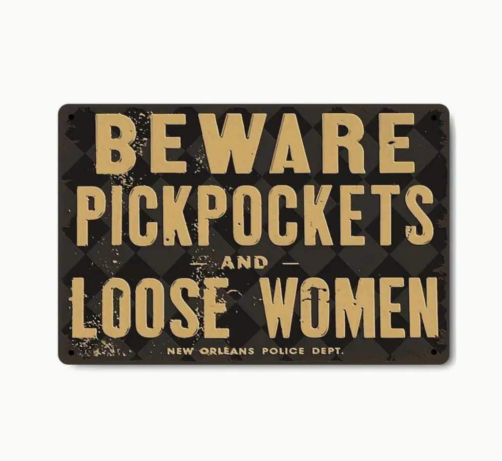 Beware Pickpockets and Loose Women sign