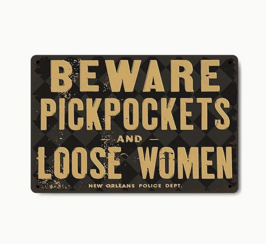 Beware Pickpockets and Loose Women sign